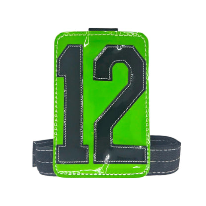 Green sports-themed phone holder with black number 12 and adjustable strap.