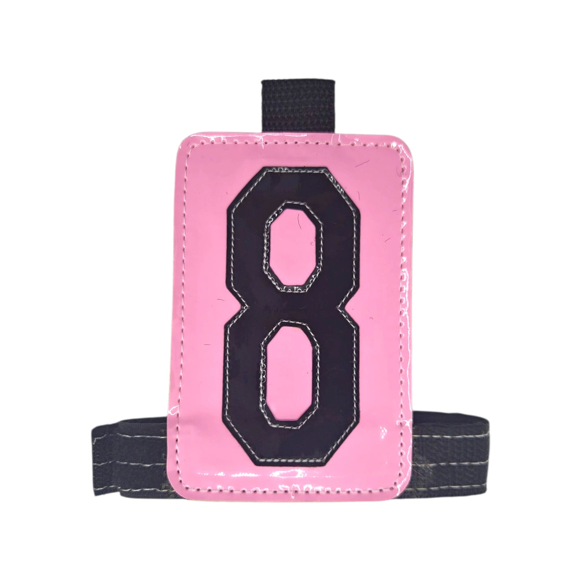 Pink luggage tag with black number 8 and a gray strap.