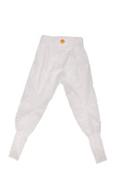 White elasticated track pants with cuffs and orange logo detail.