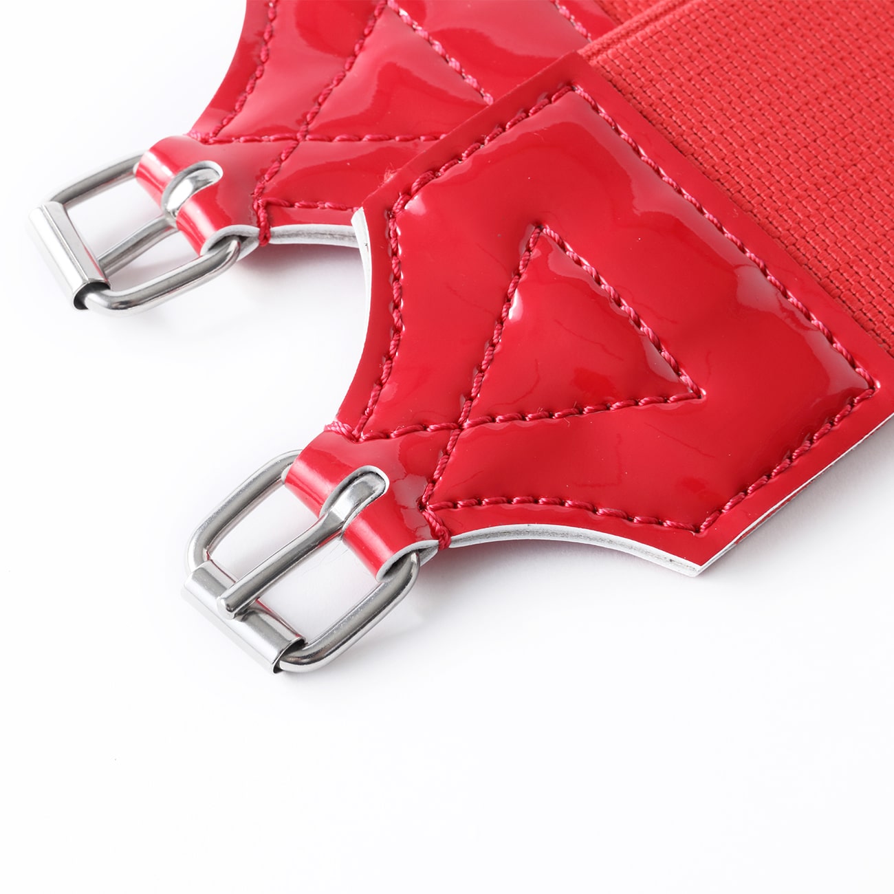 Somes stainless steel horse racing girth set in red, featuring colorful elastic channels and cinches