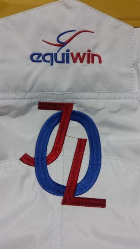 Custom medium embroidery service for horse racing and show gear by OBR, featuring vibrant thread colors.